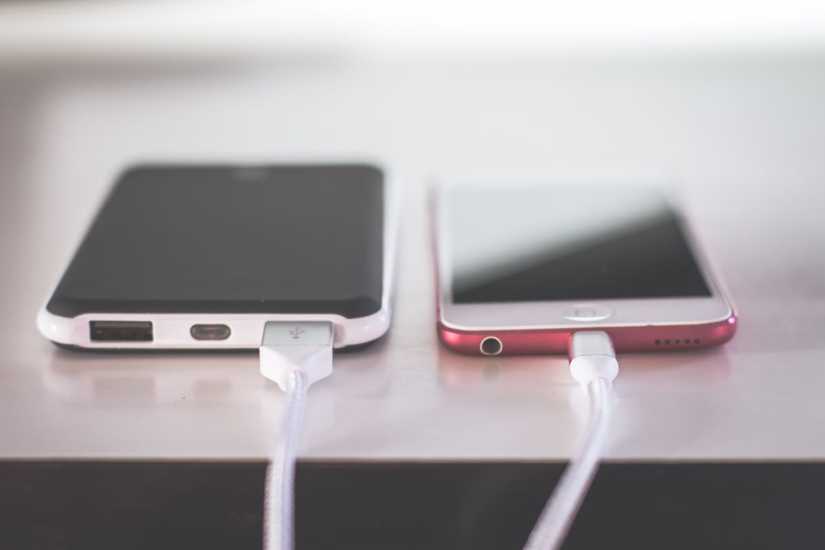 Two smartphones charging side by side